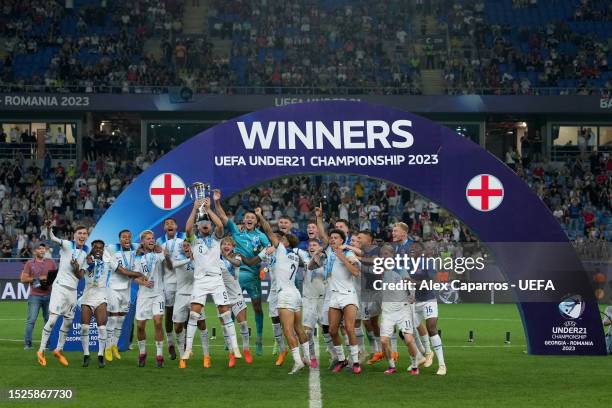 Taylor Harwood-Bellis of England lifts the Trophy after winning the UEFA Under-21 Euro 2023 final match between England and Spain at Batumi Arena on...