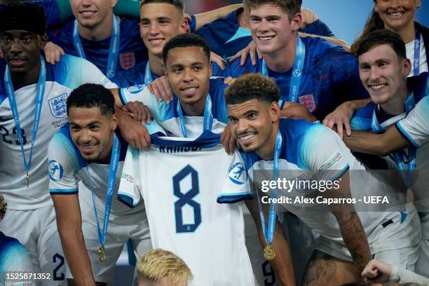 Players of England hold their teamates shirt Jacob Ramsey during the UEFA Under-21 Euro 2023 final match between England and Spain at Batumi Arena on...