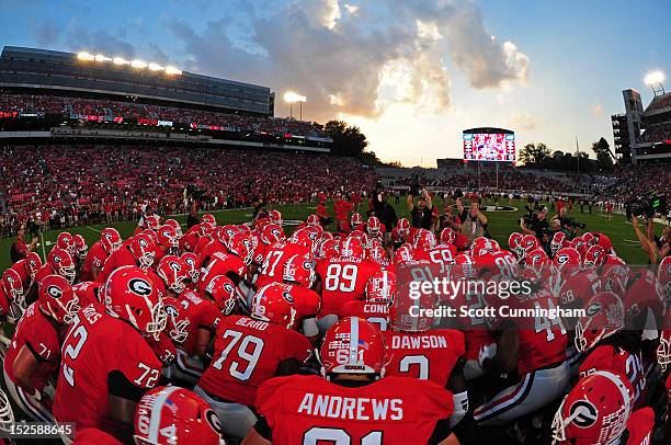 Members of the Georgia Bulldogs huddle before the game against the Vanderbilt Commodores at Sanford Stadium on September 22, 2012 in Athens, Georgia.