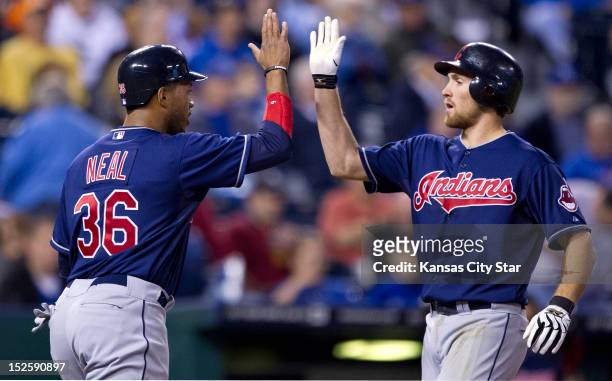 The Cleveland Indians' Thomas Neal congratulates teammate Cord Phelps , after his two-run home run in the fifth inning against the Kansas City Royals...