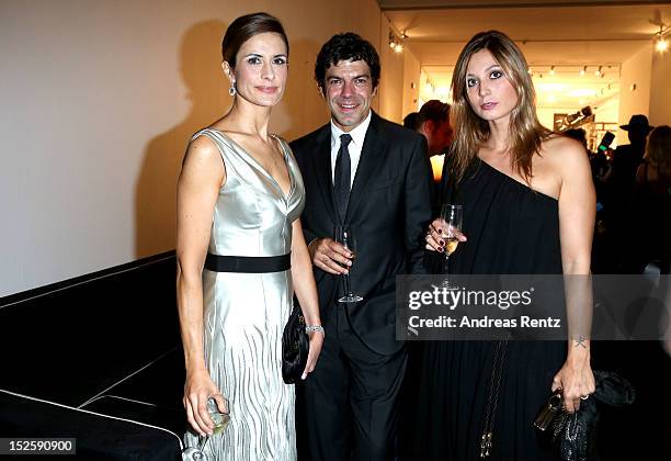 Livia Firth, Pierfrancesco Favino and Anna Ferzetti attend the amfAR Milano 2012 Cocktail reception during Milan Fashion Week at La Permanente on...