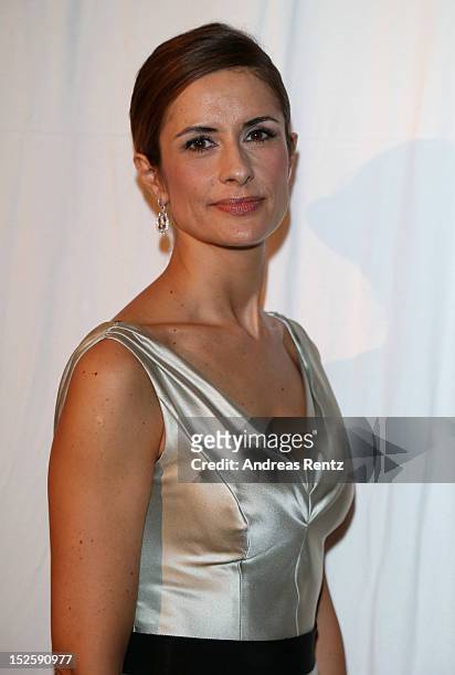 Livia Firth attends the amfAR Milano 2012 Cocktail reception during Milan Fashion Week at La Permanente on September 22, 2012 in Milan, Italy.