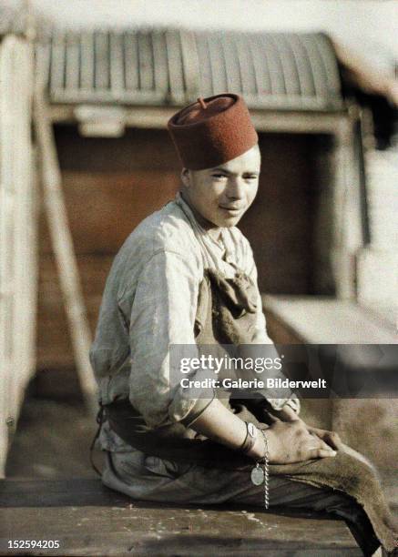 Algerian worker after the retreat of the Germans. 1917. Color photo by Fernand Cuville . World War I, Western Front. Noyon, Oise, France.