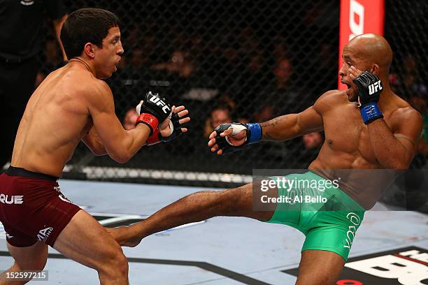 Demetrious Johnson kicks Joseph Benavidez during their flyweight championship bout at UFC 152 inside Air Canada Centre on September 22, 2012 in...