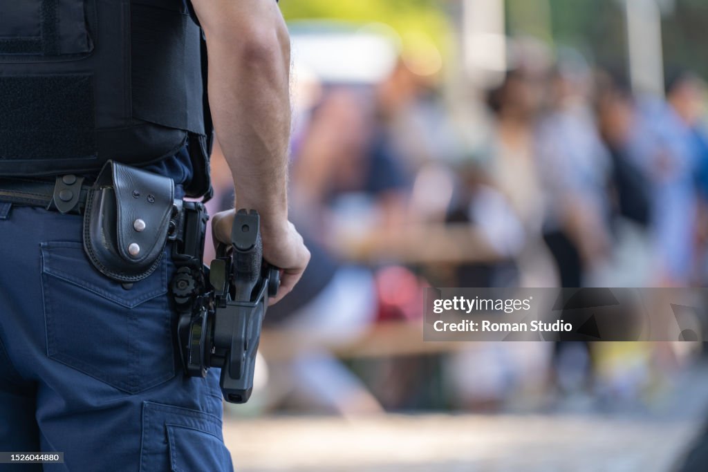 Police Weapon Roster Police Officer With Weapon At Public Events Closeup Police Equipment ...