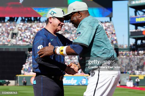 Manager Rob Thomson of the Philadelphia Phillies greets manager Dusty Baker of the Houston Astros during pregame ceremonies before the 93rd MLB...