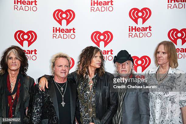 Guitarist Joe Perry, drummer Joey Kramer, vocalist Steven Tyler, guitarist Brad Whitford and bassist Tom Hamilton of Aerosmith arrive at iHeartRadio...