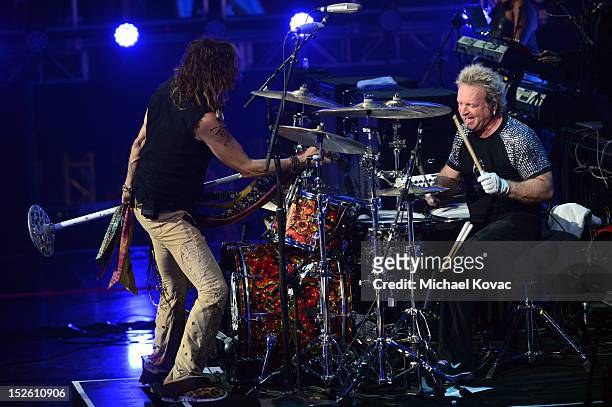 Singer Steven Tyler and drummer Joey Kramer of Aerosmith perform onstage during the 2012 iHeartRadio Music Festival at the MGM Grand Garden Arena on...