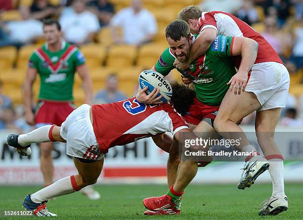 Ben Shea of the Seagulls is wrapped up by the defence during the Intrust Super Cup Grand Final match between the Wynnum Manly Seagulls and the...