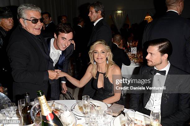 Roberto Cavalli, Daniele Cavalli, Sharon Stone and Martin Mica attend the amfAR Milano 2012 Dinner during Milan Fashion Week at La Permanente on...