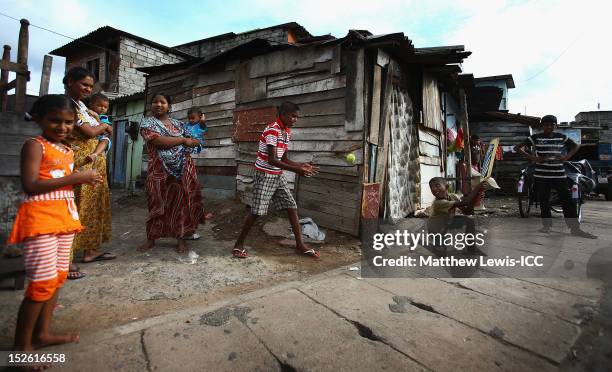 Local children play cricket on the streets outside the R. Premadasa Stadium ahead of the ICC World Twenty20 2012 Group A match between England and...