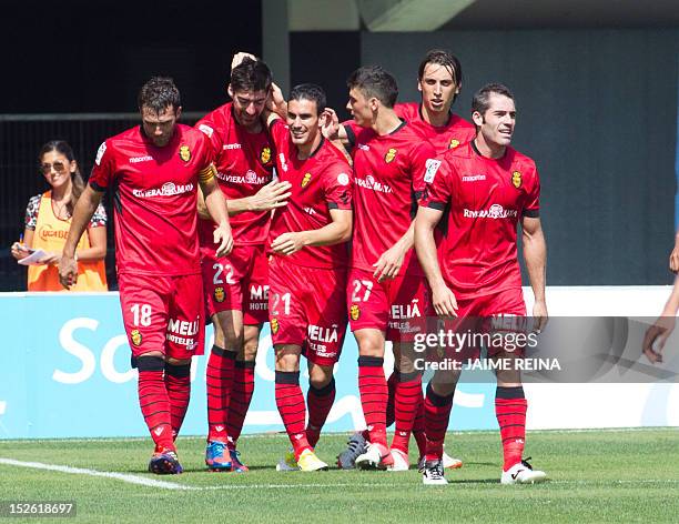 Mallorca's players celebrate after scoring during the Spanish league football match between Mallorca and Valencia on September 23 at the Iberostar...