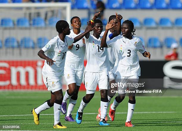 Jane Ayieyam of Ghana celebrates scoring a goal with her team mates during the FIFA U-17 Women's World Cup 2012 group D match between Ghana and...