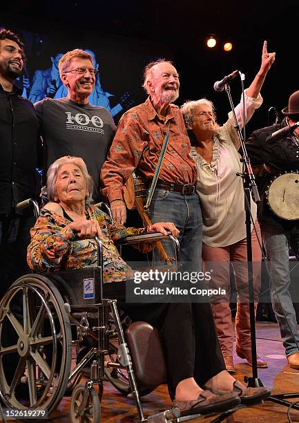 Toshi Seeger, Bob Santelli, Pete Seeger, and Nora Guthrie on stage during the 'This Land Is Your Land' Woody Guthrie At 100 Concert as part of the...