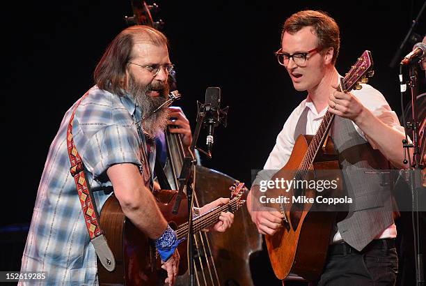 Singer/songwriter Steve Earle and members of the Tony Trischka Band perform during the 'This Land Is Your Land' Woody Guthrie At 100 Concert as part...