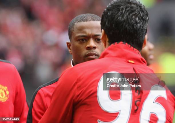 Patrice Evra of Manchester United shakes hands with Luis Suarez of Liverpool ahead of the Barclays Premier League match between Liverpool and...