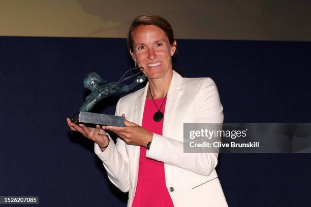 Justine Henin of Belgium poses for a photo as she's awarded the 2023 ITF Philippe Chatrier Award during The ITF World Champions Awards 2023 at The...