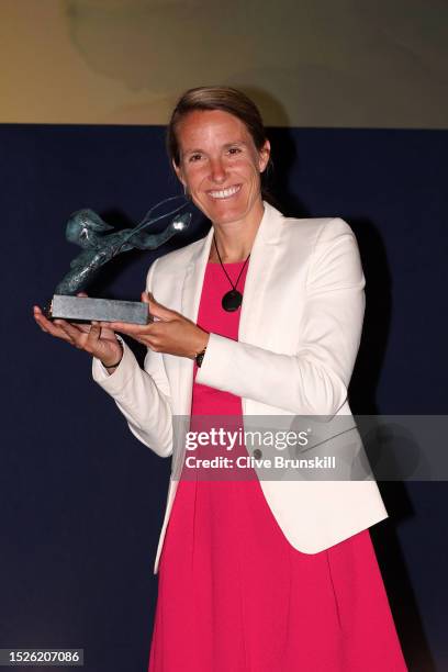 Justine Henin of Belgium poses for a photo as she's awarded the 2023 ITF Philippe Chatrier Award during The ITF World Champions Awards 2023 at The...