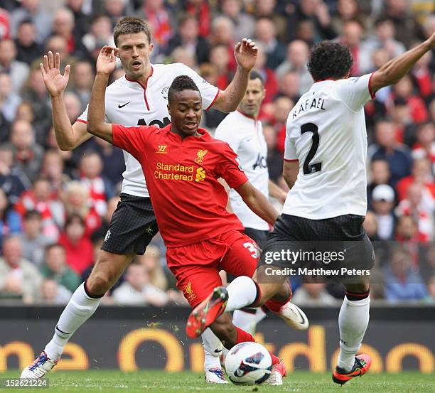 Rafael da Silva and Michael Carrick of Manchester United in action against Raheem Sterling of Liverpool during the Barclays Premier League match...