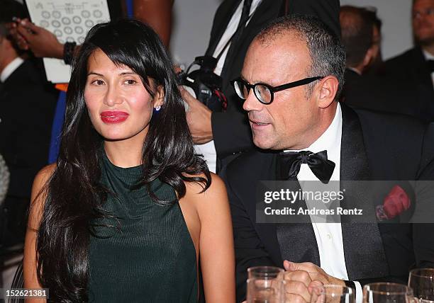 Goga Ashkenazi and Cesare Cunaccia attend the amfAR Milano 2012 Dinner during Milan Fashion Week at La Permanente on September 22, 2012 in Milan,...