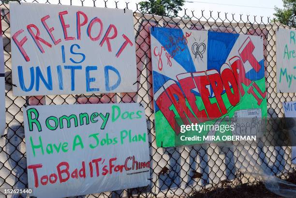 By Mira Oberman, US-vote-Republicans-Romney-cuts-economy-Bain Protest signs hang on the fence outside a camp set up by Sensata Technologies workers...