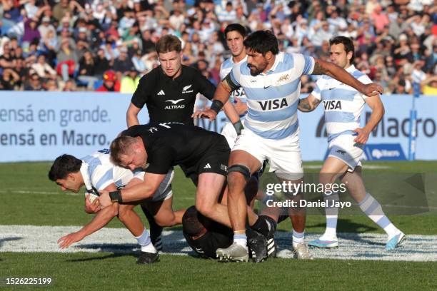 Santiago Carreras of Argentina is tackled by Sam Cane of New Zealand during a Rugby Championship match between Argentina Pumas and New Zealand All...