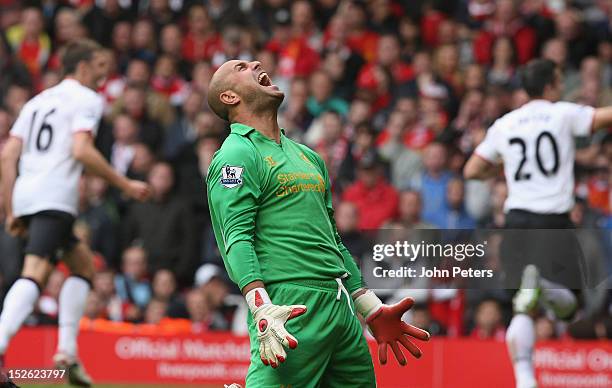 Jose Reina of Liverpool reacts to Robin van Persie of Manchester United scoring their second goal during the Barclays Premier League match between...