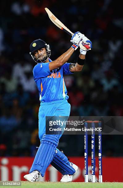Virat Kohli of India hits the ball towards the boundary during the ICC World Twenty20 2012 Group A match between England and India at R. Premadasa...