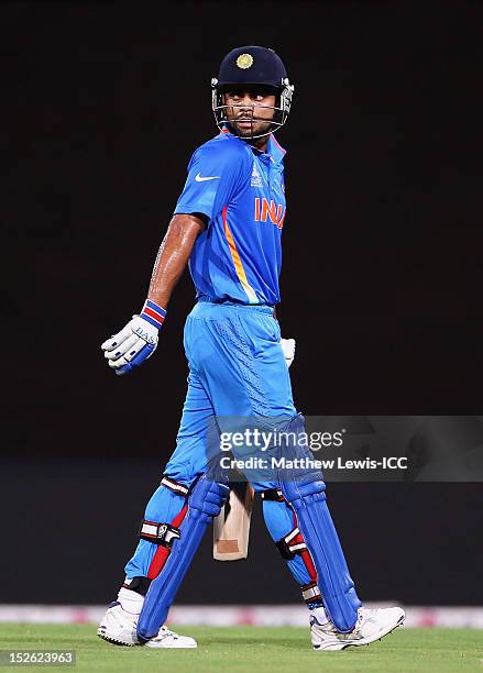 Virat Kohli of India walks off, after he was caught by Jonny Bairstow of Engand during the ICC World Twenty20 2012 Group A match between England and...