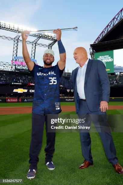 Elias Díaz of the Colorado Rockies is presented the Ted Williams All-Star Game MVP award by Cal Ripken Jr. After the 93rd MLB All-Star Game presented...