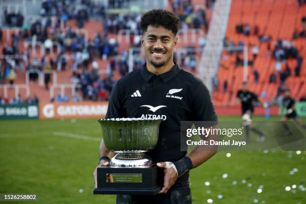 Emoni Narawa of New Zealand poses with the trophy after winning a Rugby Championship match between Argentina Pumas and New Zealand All Blacks at...