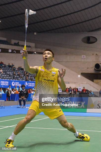 Chong Wei Lee of Malaysia competes in the Men's singles final match against Boonsak Ponsana of Thailand during day five of the Yonex Open Japan 2012...