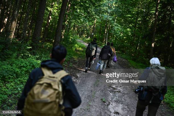 Migrants from Morocco who lived in the forest for 23 days and claimed to be pushed back to Belarus 3 times walk together with workers and volunteers...
