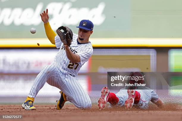 Matt McLain of the Cincinnati Reds steals second base past the tag of Willy Adames of the Milwaukee Brewers in the fifth inning at American Family...