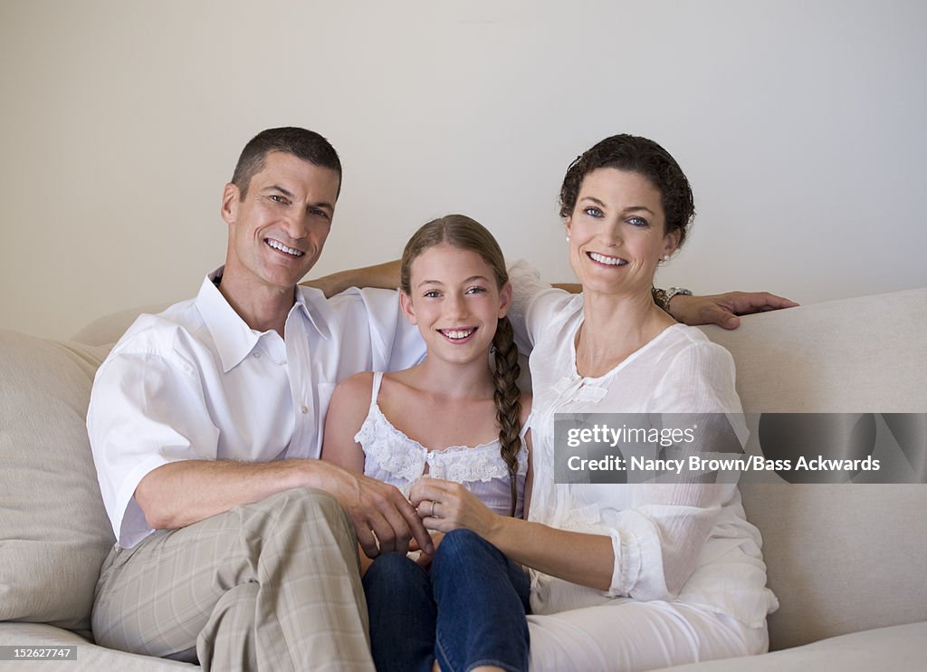 Caucasian Family Sitting on Couch.