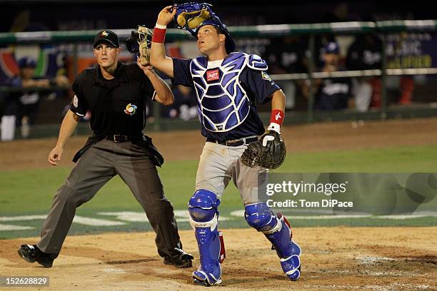 Boris Marche of Team France tracks a foul ball during game 2 of the Qualifying Round of the 2013 World Baseball Classic at Roger Dean Stadium against...