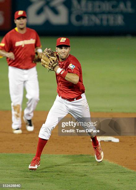 Paco Figueroa of Team Spain throws to first base during game 2 of the Qualifying Round of the 2013 World Baseball Classic at Roger Dean Stadium...