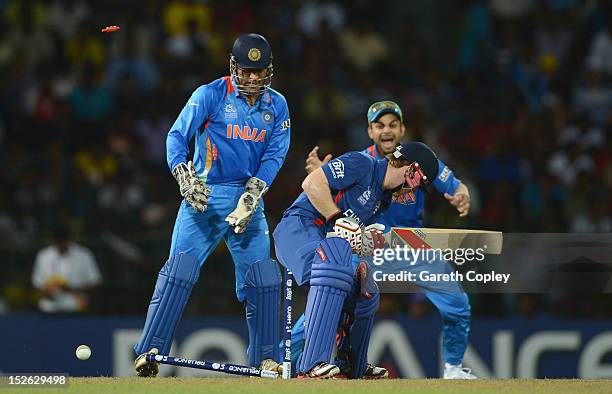 Eoin Morgan of England is bowled Harbhajan Singh of India during the ICC World Twenty20 2012 Group A match between England and India at R. Premadasa...