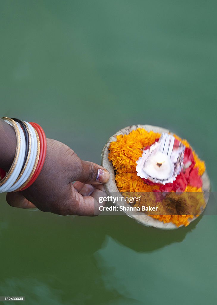 Prayer candle released into Ganges