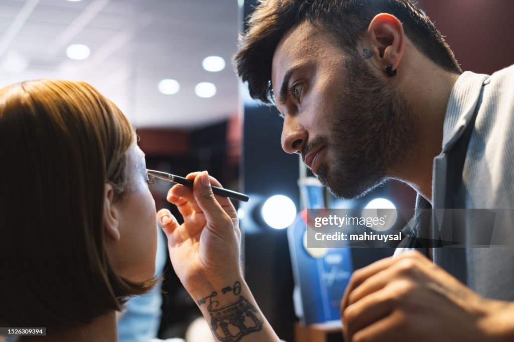 Makeup Artist Working Applying The Eyeshadow