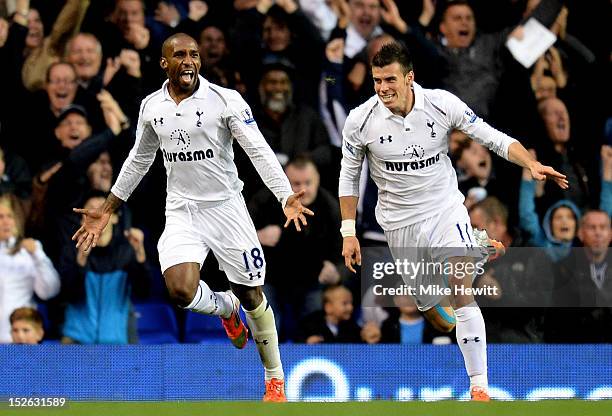 Jermain Defoe of Spurs celebrates with teammate Gareth Bale after scoring his team's second goal during the Barclays Premier League match between...
