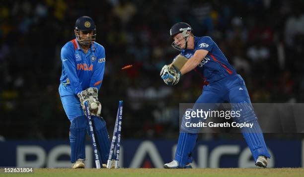 Jos Buttler of England is bowled Harbhajan Singh of India during the ICC World Twenty20 2012 Group A match between England and India at R. Premadasa...