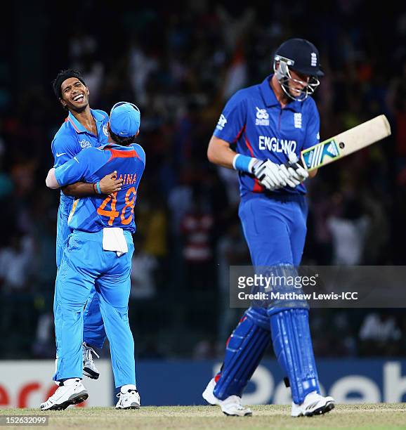 Ashok Dinda of India is congratulated by Suresh Raina, after Stuart Broad was caught by Gautam Gambhir during the ICC World Twenty20 2012 Group A...