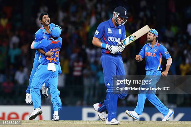 Ashok Dinda of India is congratulated by Suresh Raina, after Stuart Broad was caught by Gautam Gambhir during the ICC World Twenty20 2012 Group A...