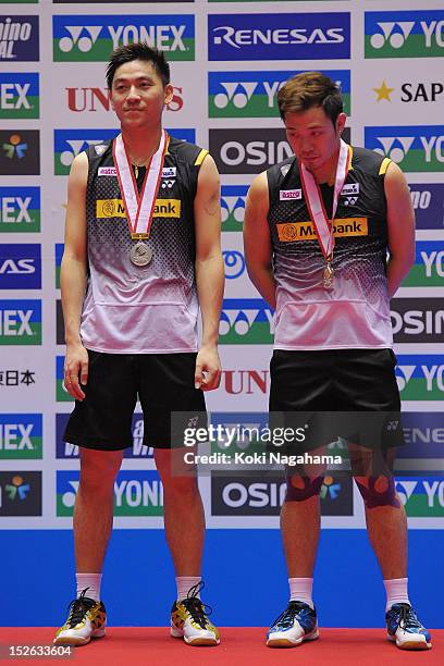 Boon Heong Tan and ien Keat Koo of Malaysia pose on the podium after losing the men's doubles final match against Sa Rang Kim and Ki Jung Kim of...