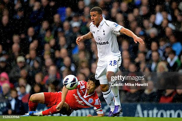 Ji-Sung Park of QPR and Kyle Walker of Spurs compete for the ball during the Barclays Premier League match between Tottenham Hotspur and Queens Park...