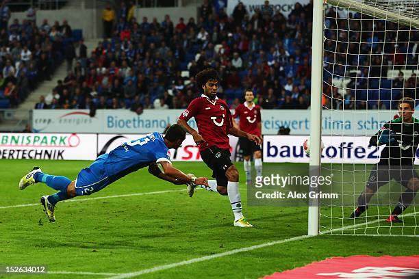 Sejad Salihovic of Hoffenheim scores his team's second goal against Felipe and goalkeeper Ron-Robert Zieler of Hannover during the Bundesliga match...