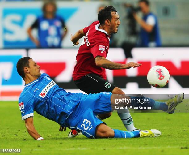 Sergio da Silva Pinto of Hannover is challenged by Sejad Salihovic of Hoffenheim during the Bundesliga match between 1899 Hoffenheim and Hannover 96...