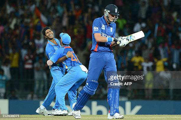 Indian cricketer Ashok Dinda celebrates after he dismissed England cricketer Stuart Broad during the ICC Twenty20 Cricket World Cup match between...