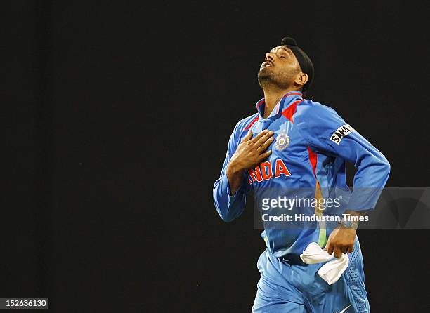 Indian bowler Harbhajan Singh celebrates after he took four wickets during the ICC T20 World Cup cricket match between India and England at R....